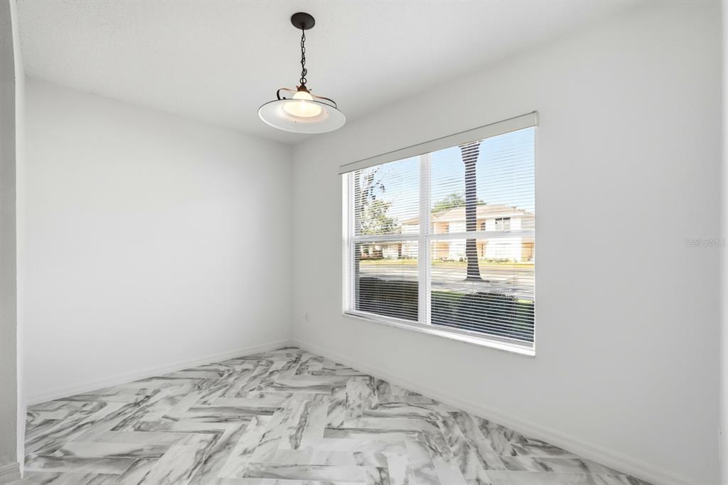 1502 Deer Springs Road Port Orange, FL 32129 - Photo 6 of 35 a view of an empty room with a window