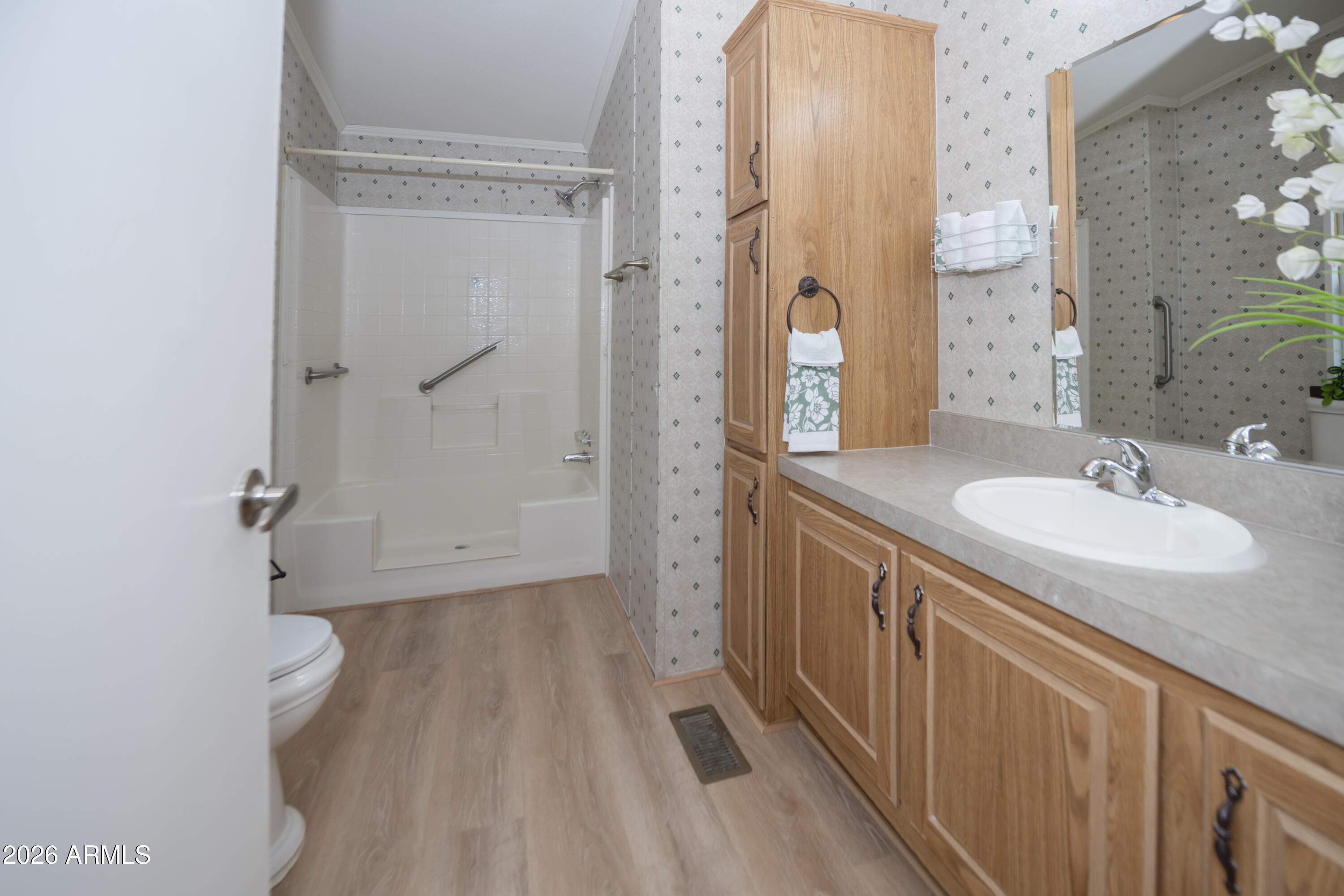 11250 East State Rte 69, Unit 1125 Dewey, AZ 86327 - Photo 22 of 45 a bathroom with a sink a mirror and a shower