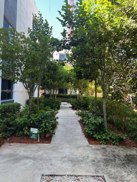 751 Northwest 1st Street, Unit 103 Miami, FL 33128 - Photo 3 of 11 a view of a pathway with a park