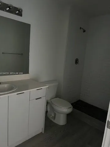 a bathroom with a toilet and a sink