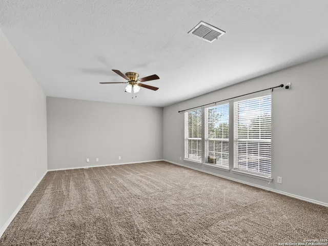 an empty room with windows