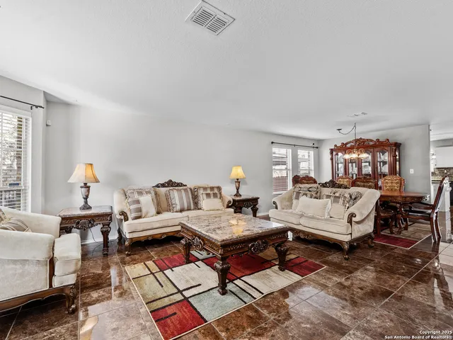 a living room with furniture and a couch