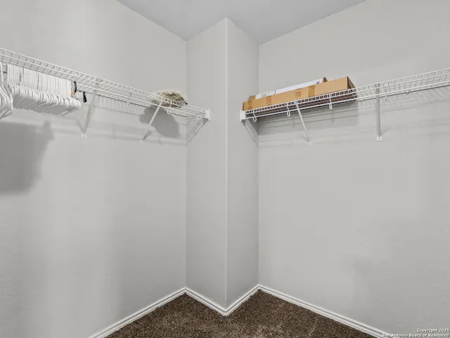 a view of small space with racks on the wall