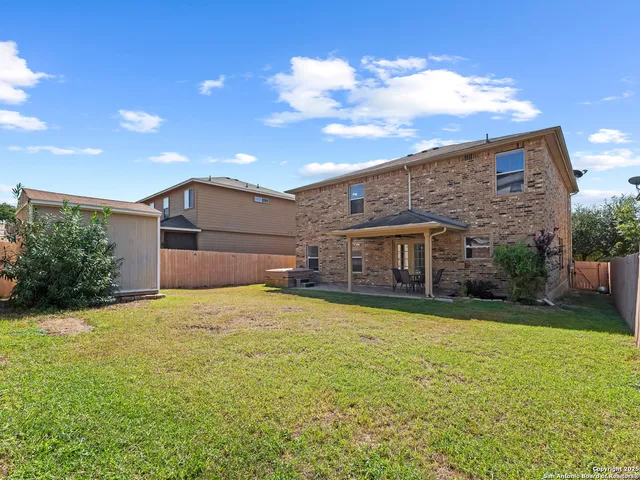 a big house with swimming pool in front of it