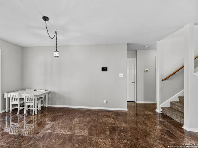 a view of a dining room with furniture