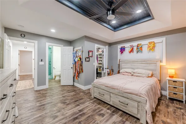 a bedroom with a bed and a walk in closet