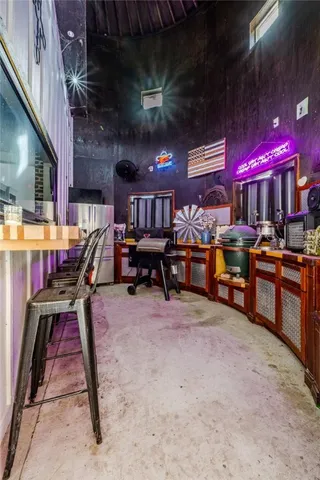 a view of a chairs and tables in a patio