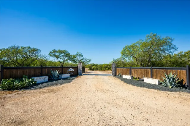 a view of balcony with wooden fence