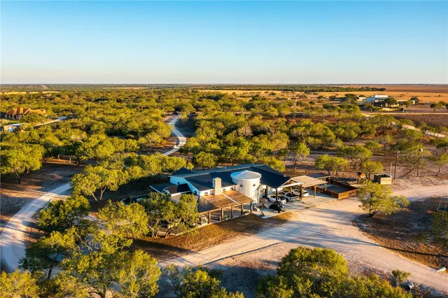 an aerial view of residential building and ocean