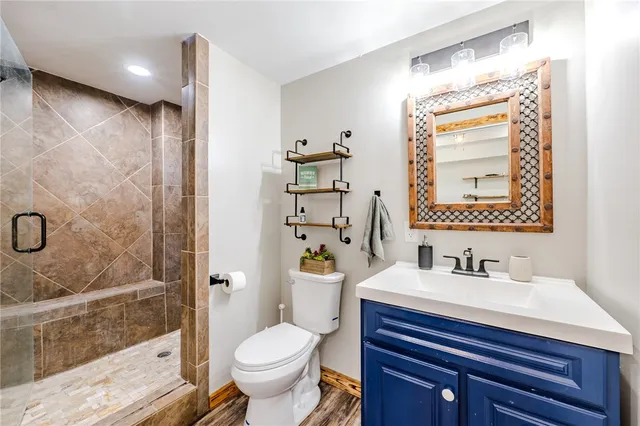 a bathroom with a sink toilet and shower