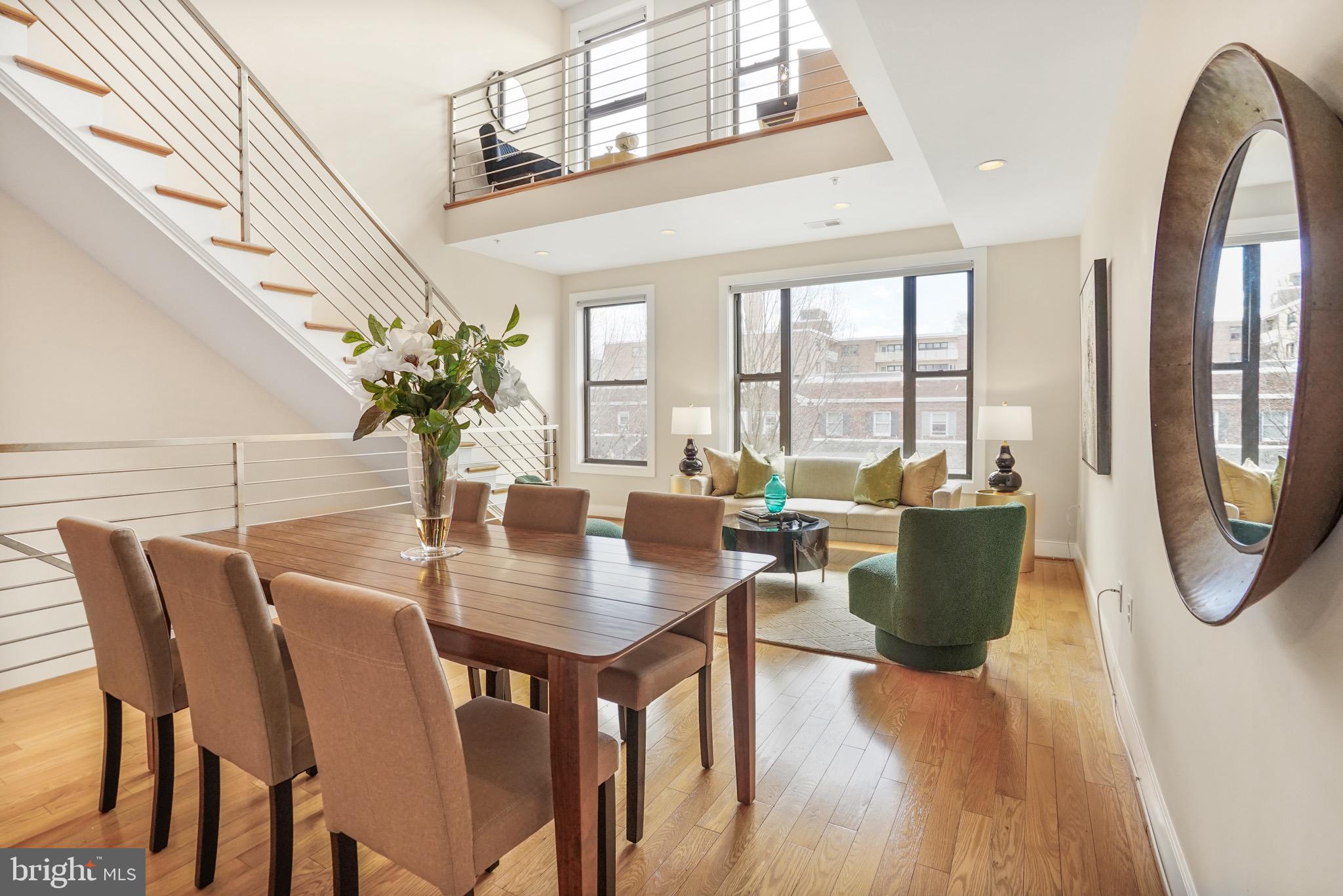 a view of a dining room with furniture window and wooden floor