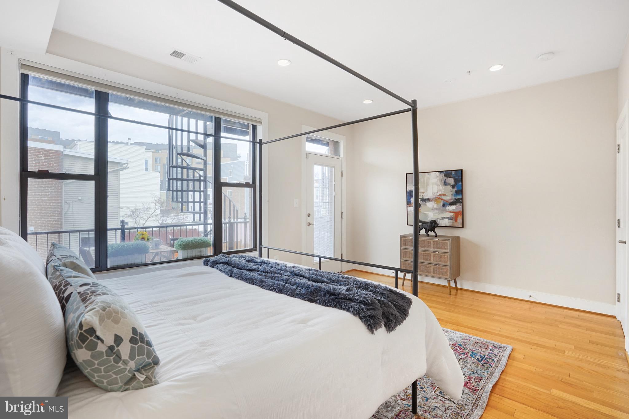 1402 K Street Southeast, Unit 2 Washington, DC 20003 - Photo 11 of 32 a bedroom with a large bed and a large window