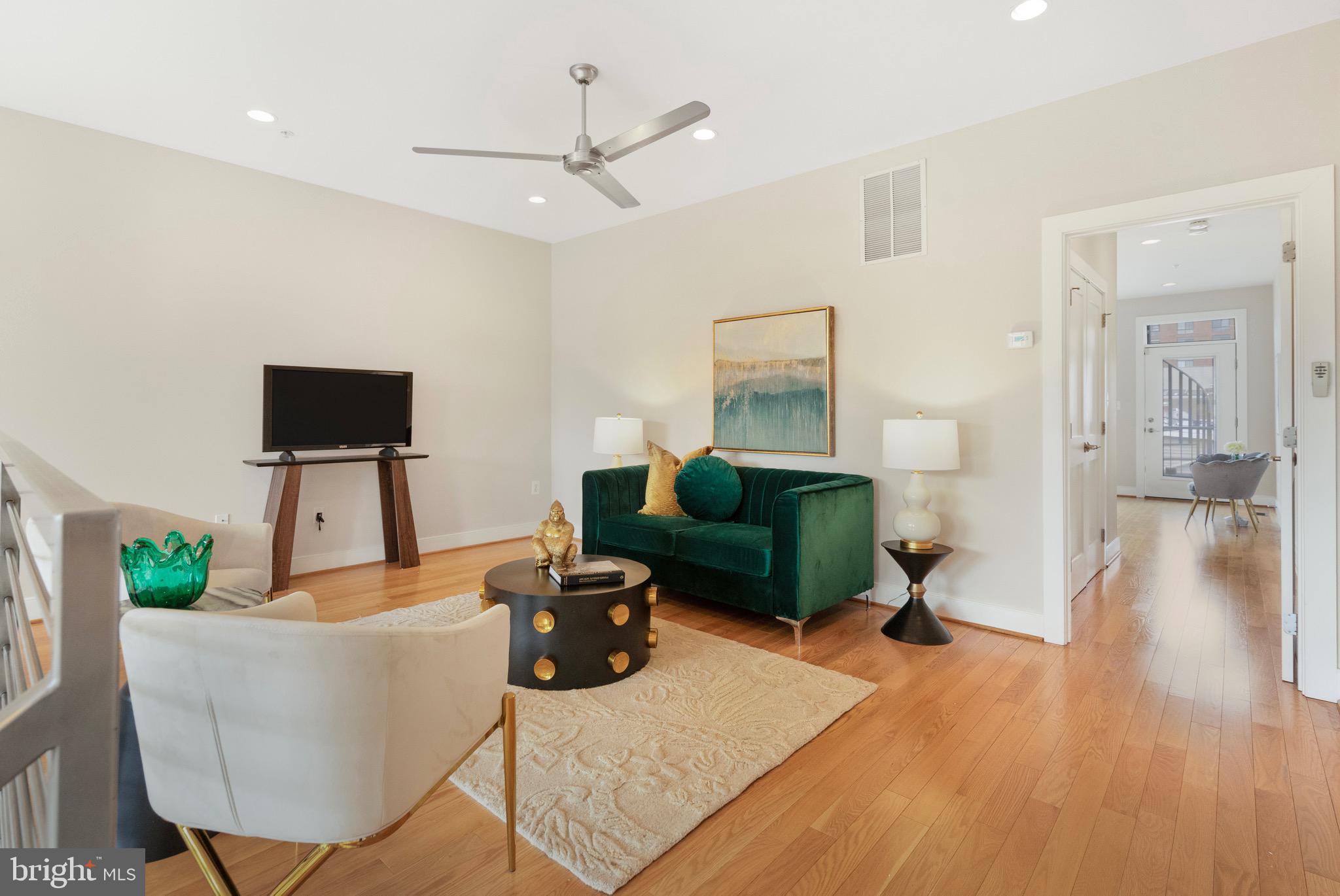 1402 K Street Southeast, Unit 2 Washington, DC 20003 - Photo 16 of 32 a living room with furniture and a flat screen tv