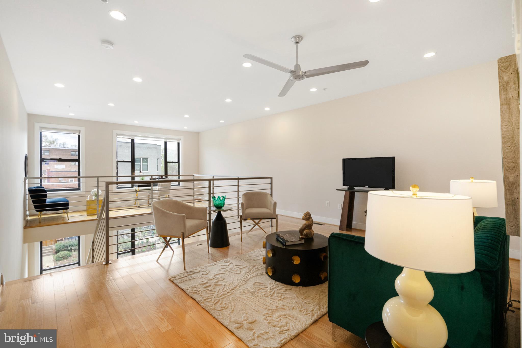 1402 K Street Southeast, Unit 2 Washington, DC 20003 - Photo 17 of 32 a living room with furniture and a flat screen tv
