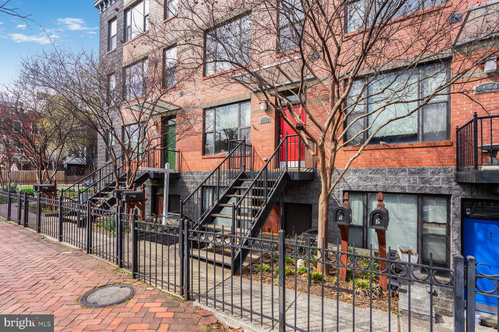 1402 K Street Southeast, Unit 2 Washington, DC 20003 - Photo 2 of 32 a front view of a house with wooden fence