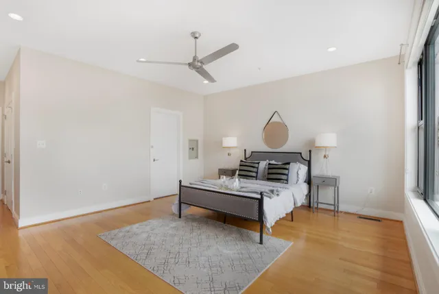 a bathroom with a double vanity sink a mirror and shower
