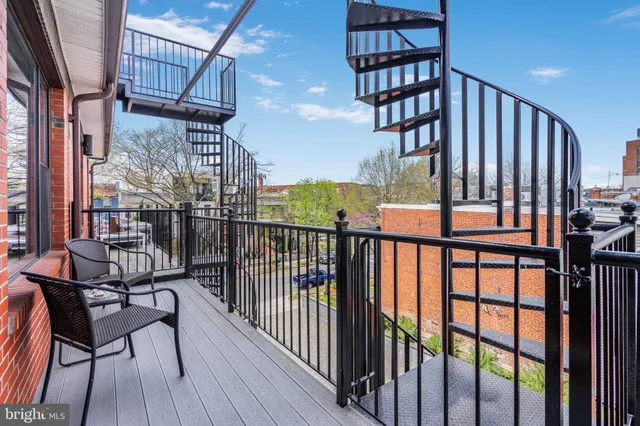 a view of a roof deck with couches