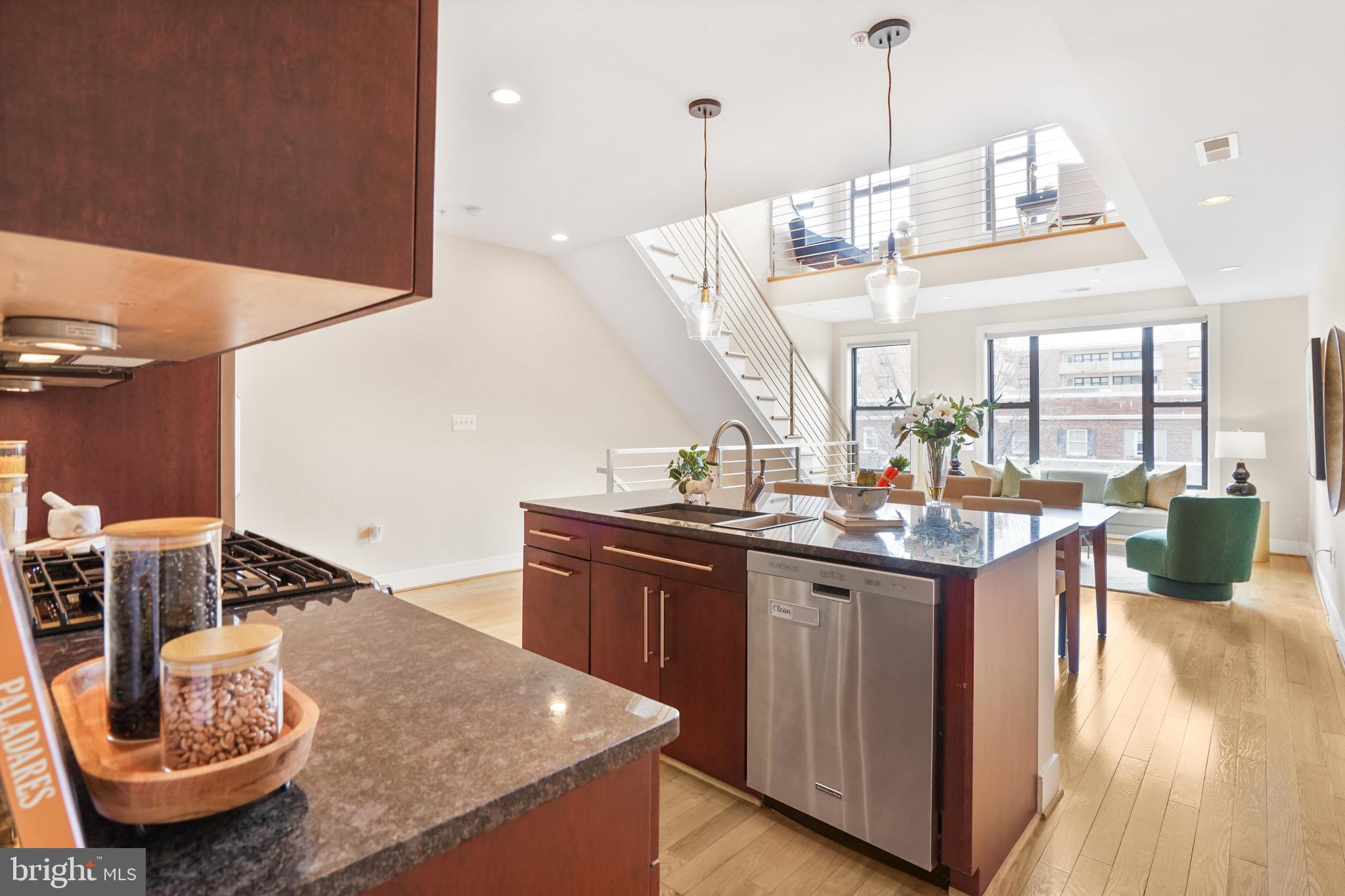 1402 K Street Southeast, Unit 2 Washington, DC 20003 - Photo 7 of 32 a kitchen with stainless steel appliances granite countertop a sink a stove and a wooden floors