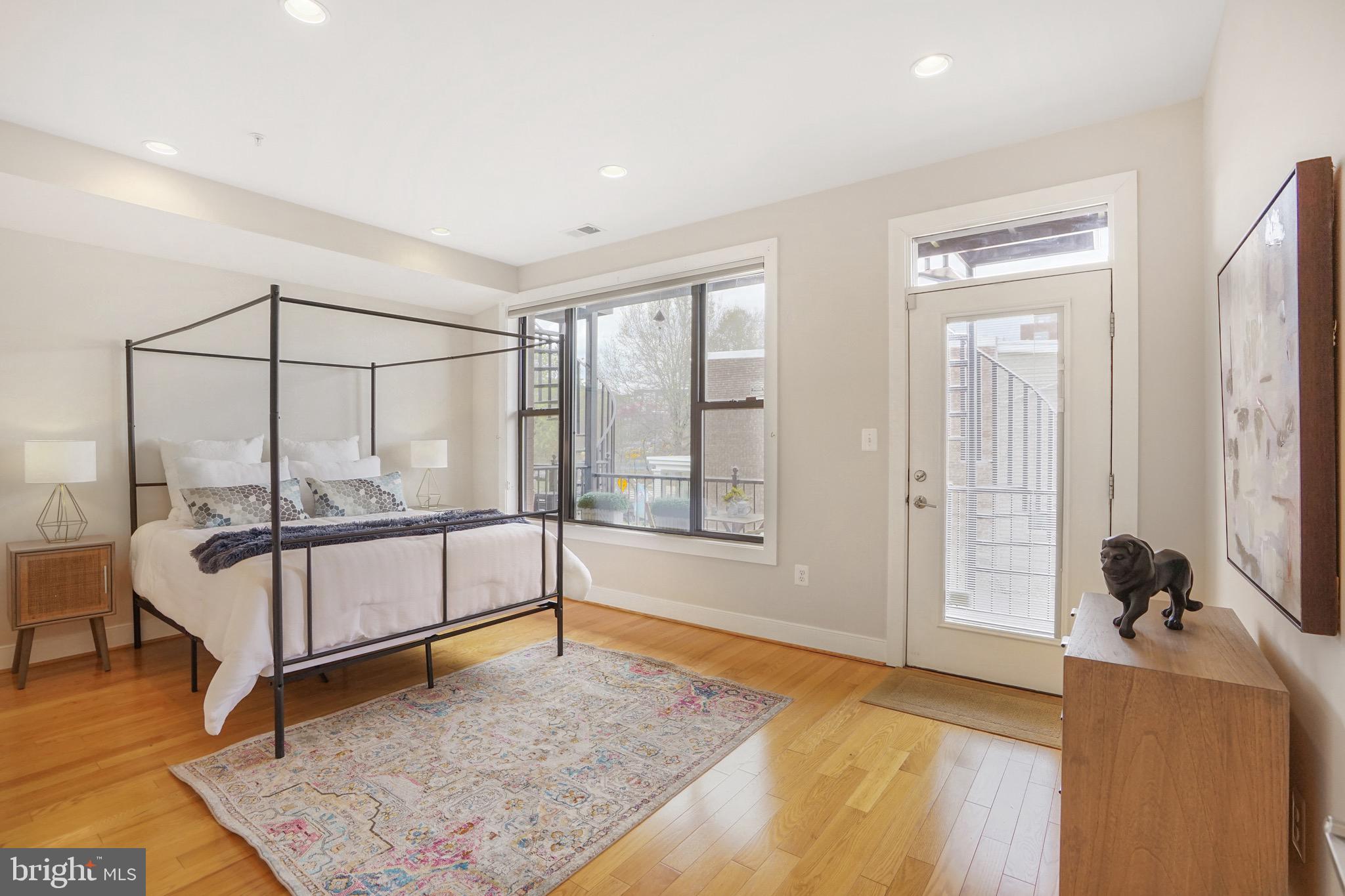 1402 K Street Southeast, Unit 2 Washington, DC 20003 - Photo 10 of 32 a spacious bedroom with a bed and wooden floor