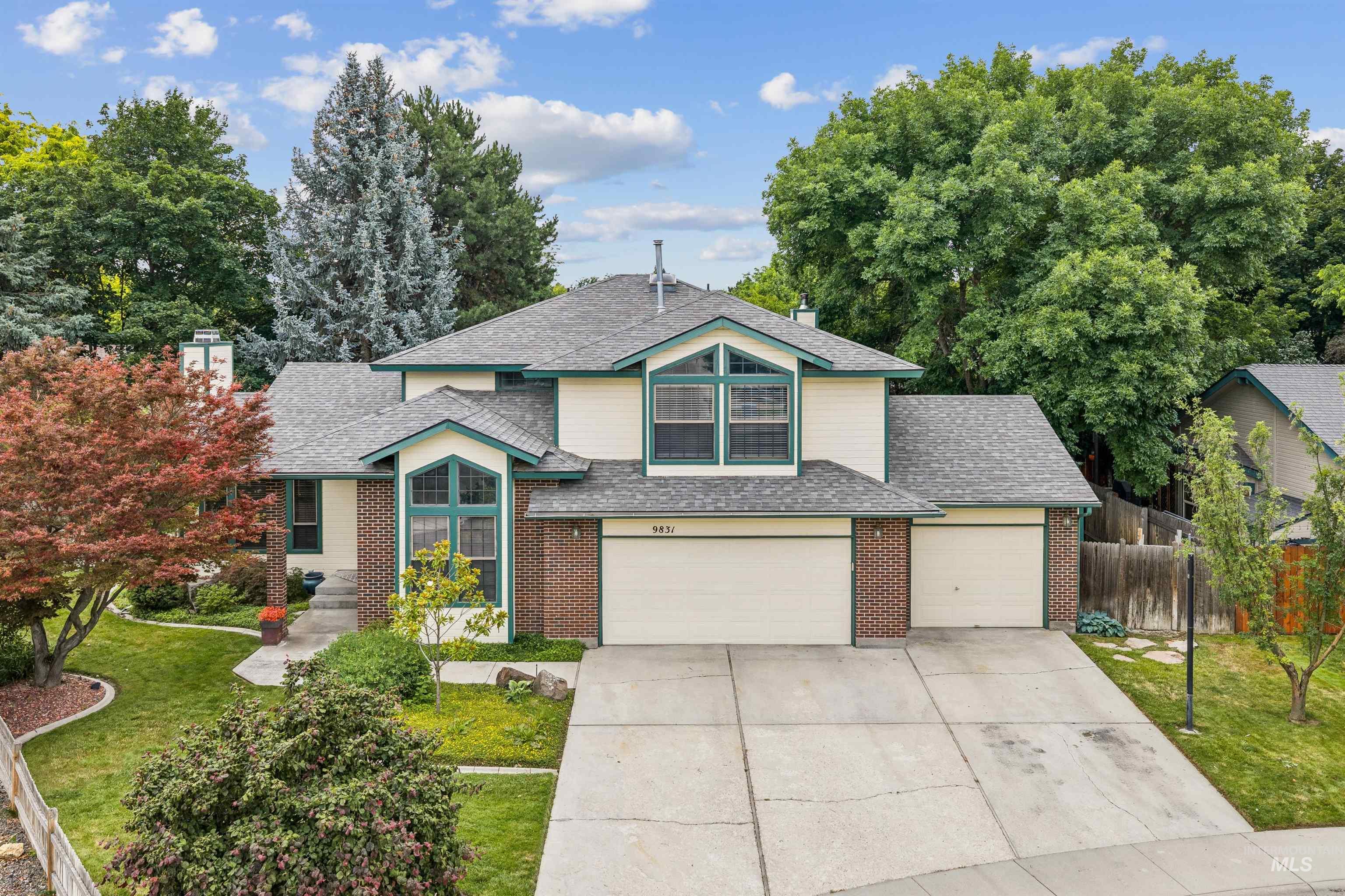 9831 West Ripley Street Boise, ID 83704 - Photo 1 of 47 Two-story residence featuring light-colored siding with brick accents and dark trim