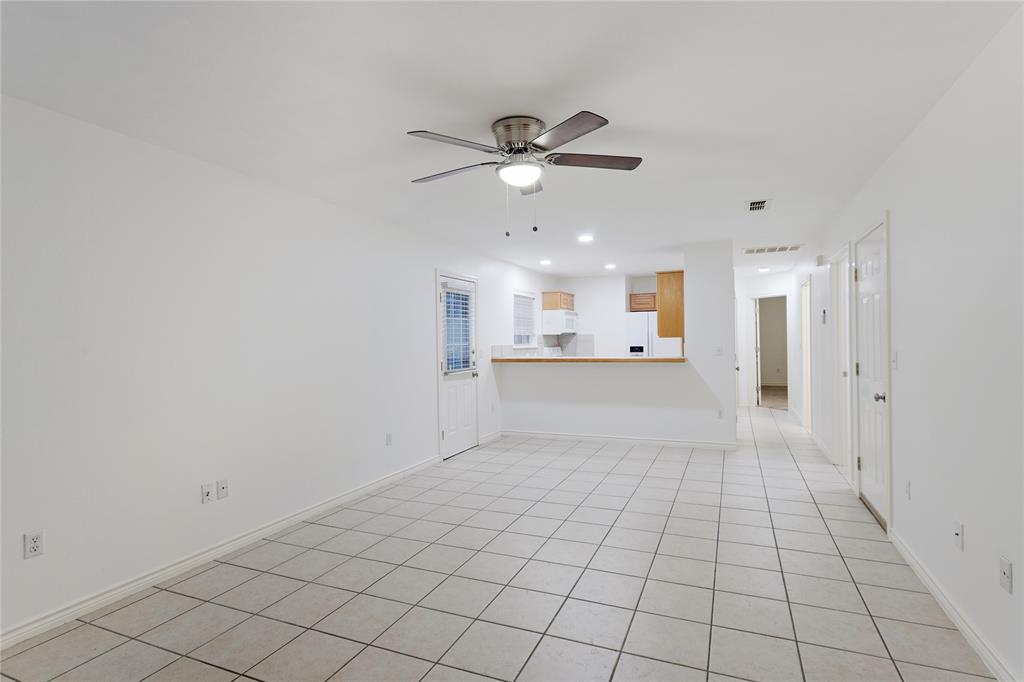 1021 Rice Street, Unit 102 Denison, TX 75020 - Photo 3 of 18 a view of an empty room and window
