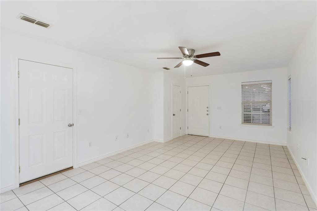1021 Rice Street, Unit 102 Denison, TX 75020 - Photo 5 of 18 a view of an empty room with a window