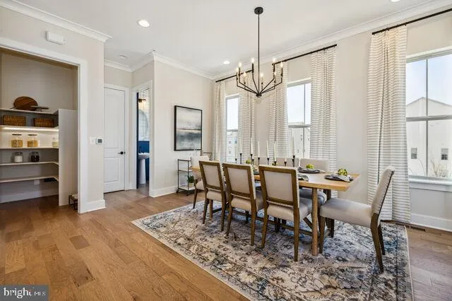 a dining room with furniture window wooden floor
