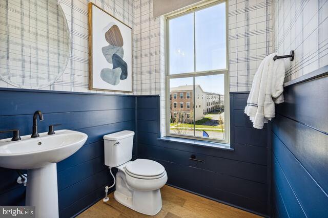 14917 Dispatch Street Rockville, MD 20850 - Photo 26 of 29 a bathroom with a toilet a sink and a window
