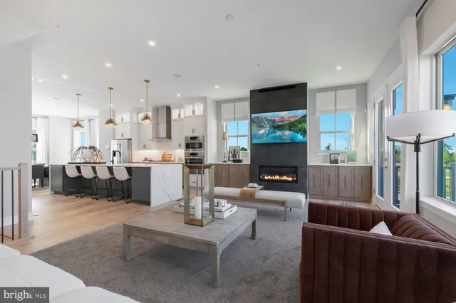 a living room with fireplace furniture and a flat screen tv