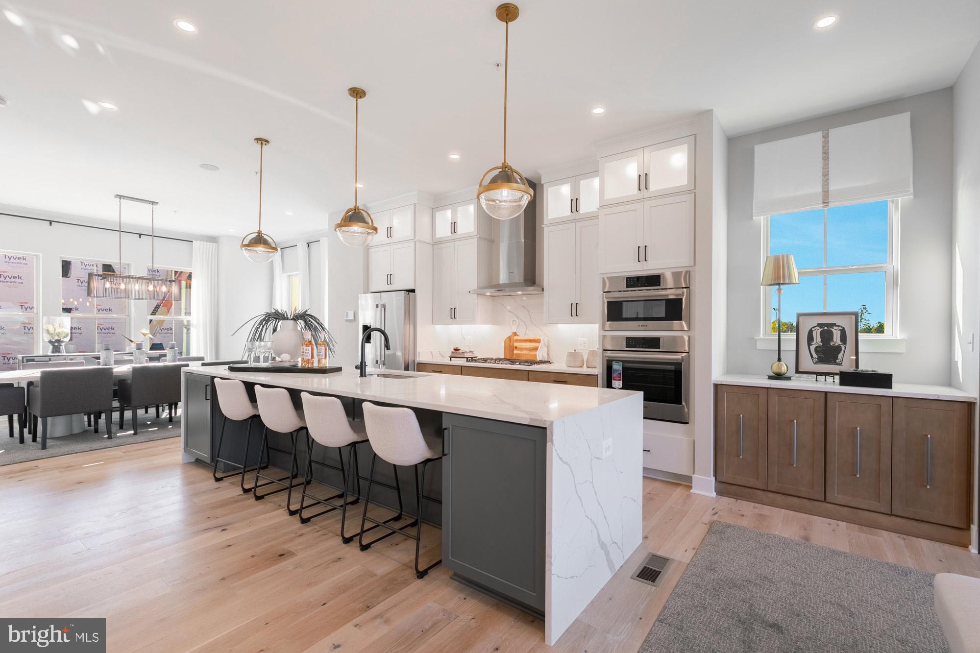 14917 Dispatch Street Rockville, MD 20850 - Photo 6 of 29 a large kitchen with lots of counter space and furniture