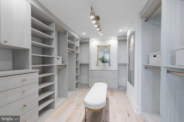 a bathroom with a sink a toilet and a shower