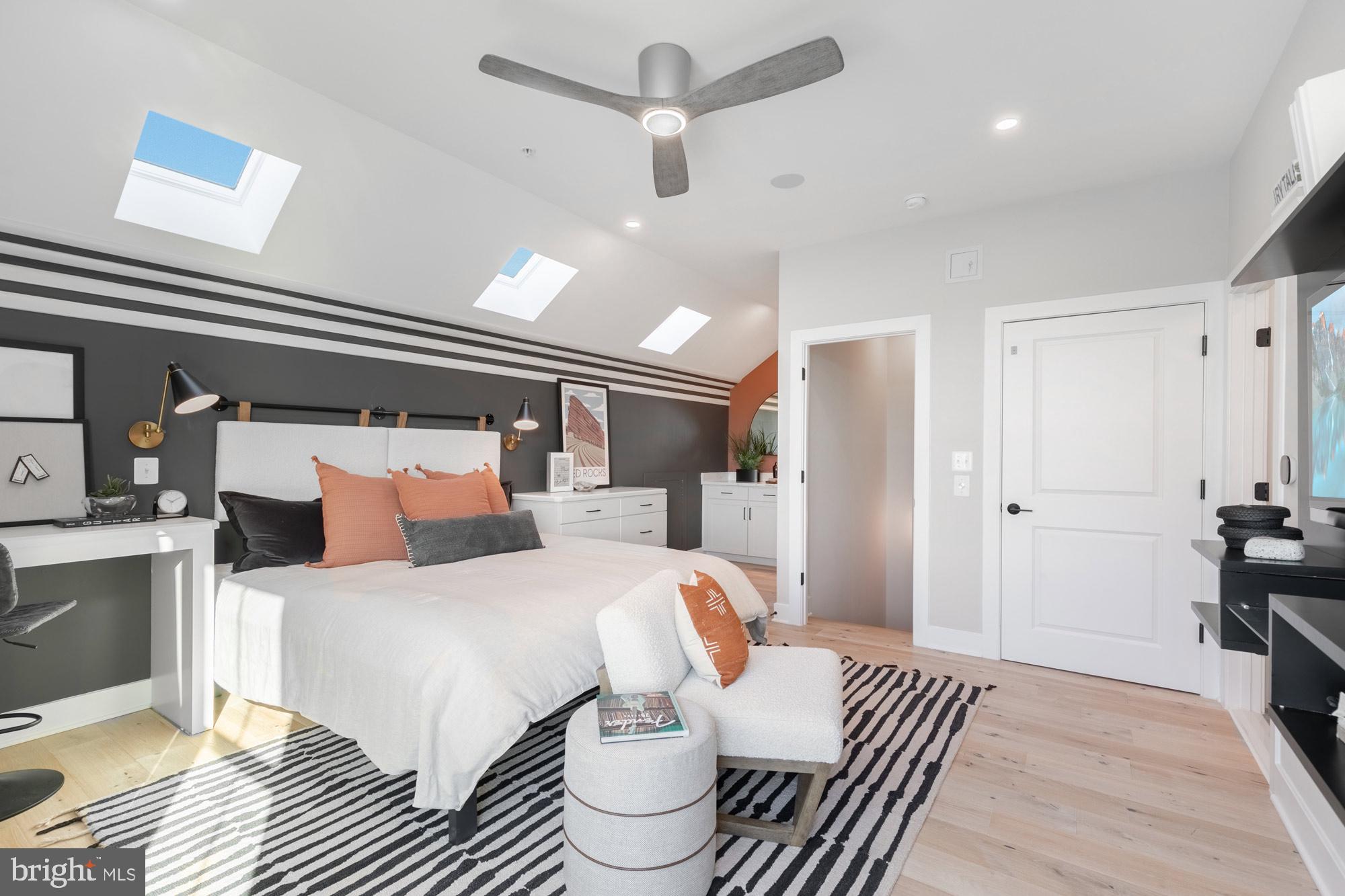 14917 Dispatch Street Rockville, MD 20850 - Photo 10 of 29 a bedroom with a bed and wooden floor