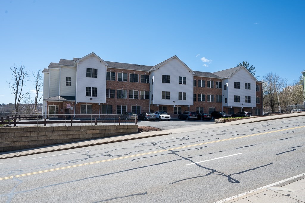 a front view of a building with street view