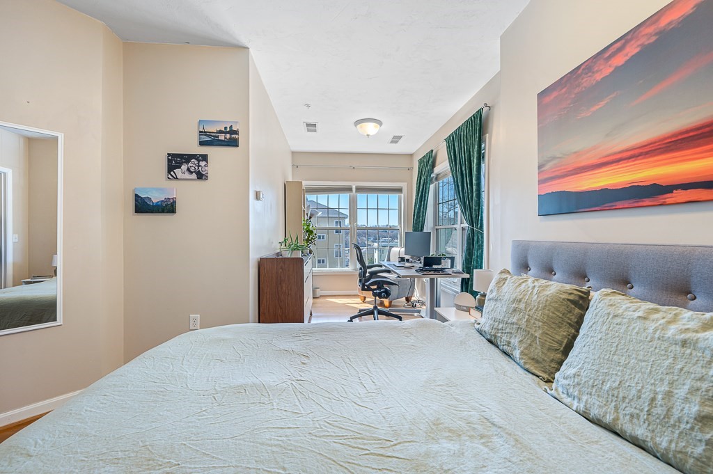 50 Adams Street, Unit 101 Worcester, MA 01604 - Photo 11 of 20 a bedroom with furniture and a window