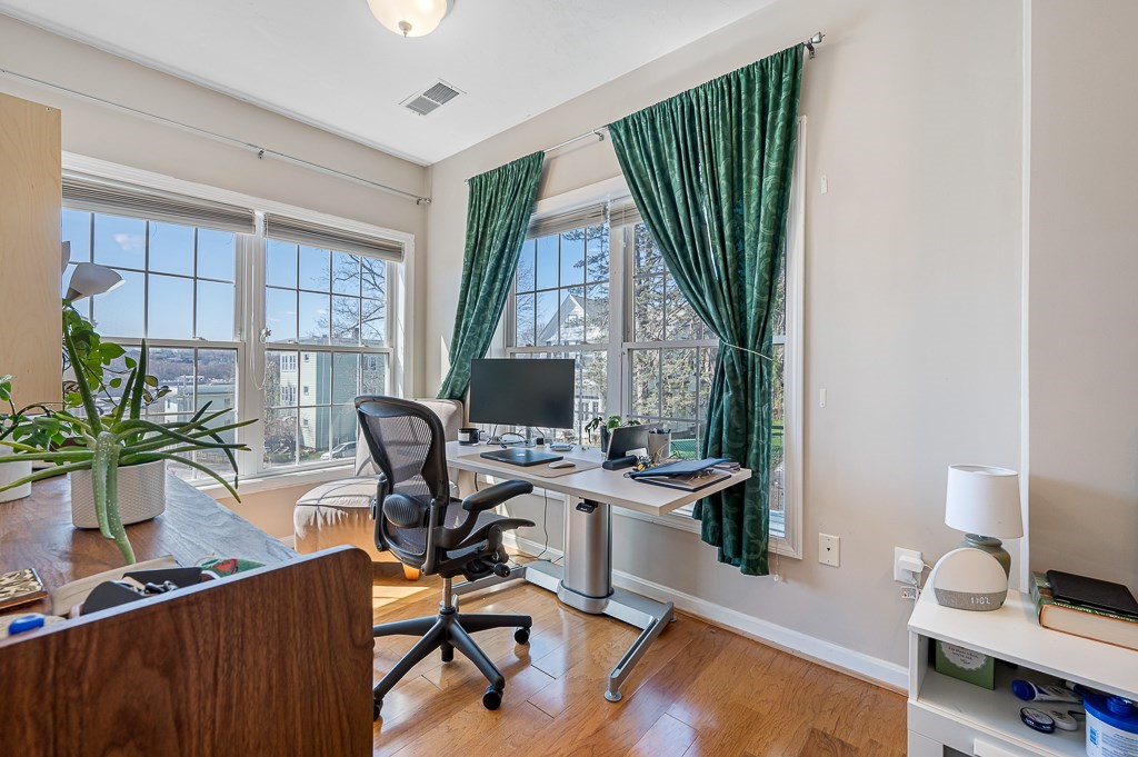 50 Adams Street, Unit 101 Worcester, MA 01604 - Photo 12 of 20 a view of a workspace with furniture and a window
