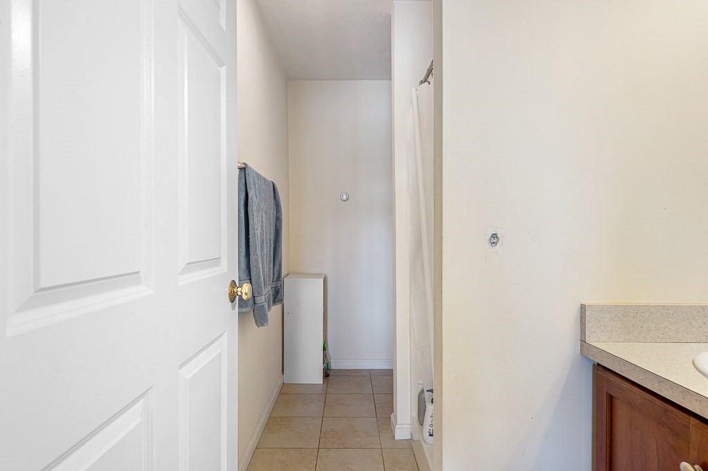 50 Adams Street, Unit 101 Worcester, MA 01604 - Photo 13 of 20 a view of a bathroom from a hallway
