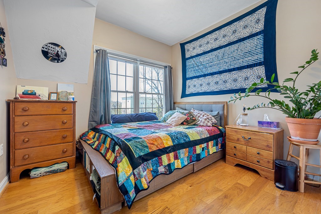 50 Adams Street, Unit 101 Worcester, MA 01604 - Photo 15 of 20 a bedroom with a bed and a window
