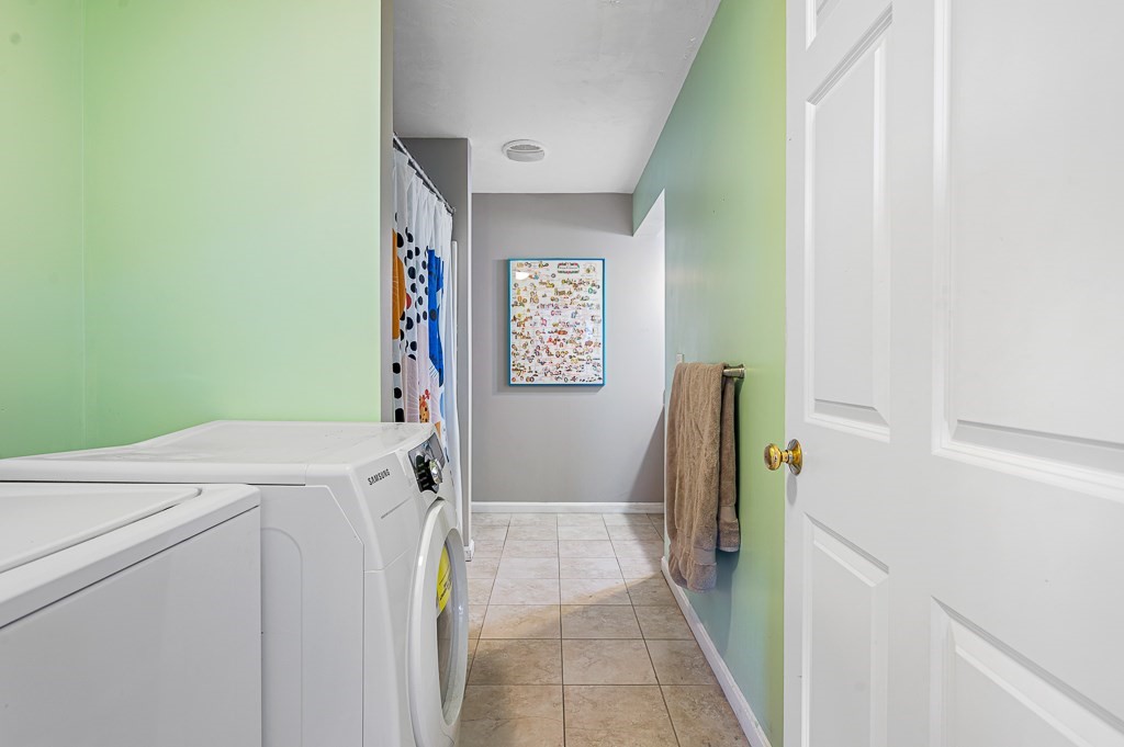 50 Adams Street, Unit 101 Worcester, MA 01604 - Photo 16 of 20 a utility room with dryer and washer