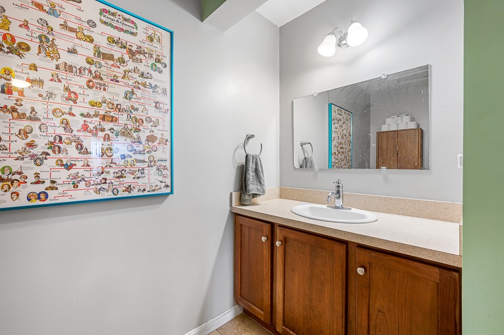 50 Adams Street, Unit 101 Worcester, MA 01604 - Photo 17 of 20 a bathroom with a sink and a mirror