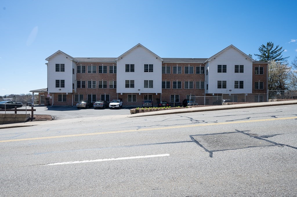 50 Adams Street, Unit 101 Worcester, MA 01604 - Photo 19 of 20 a view of building with a street