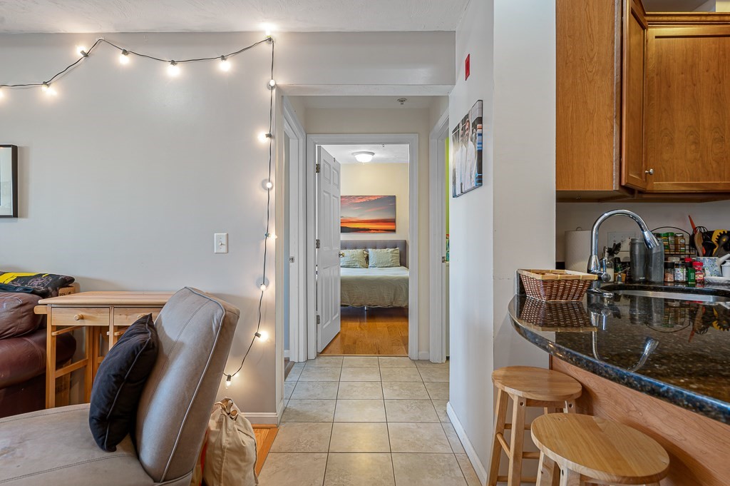 50 Adams Street, Unit 101 Worcester, MA 01604 - Photo 6 of 20 a view of a hallway with furniture and entryway