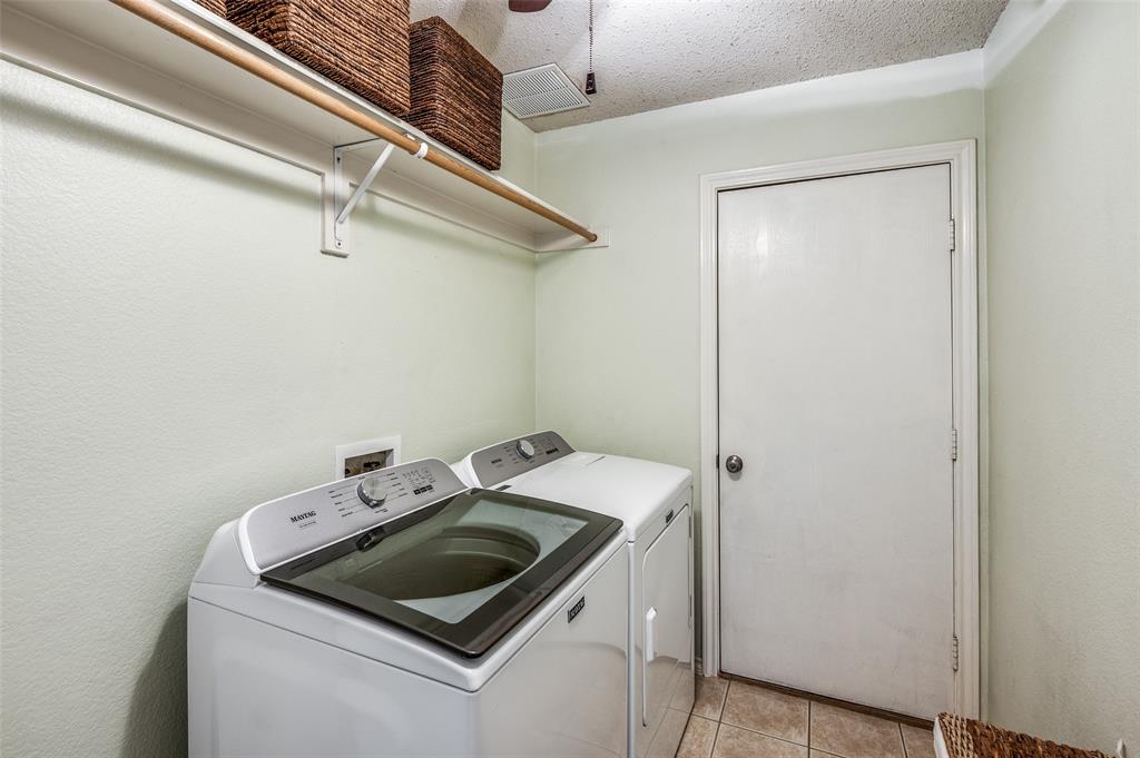 8606 Scooner Street Rowlett, TX 75089 - Photo 25 of 30 a utility room with dryer and washer