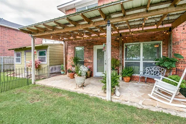 a view of a backyard with a patio