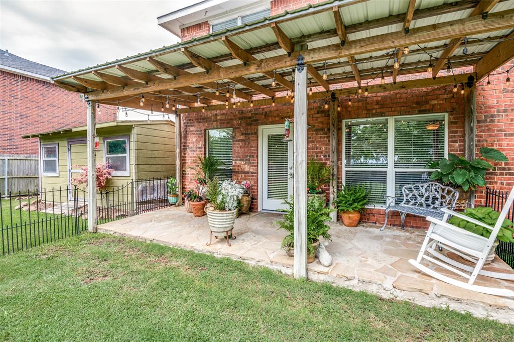 8606 Scooner Street Rowlett, TX 75089 - Photo 27 of 30 a view of a backyard with a patio