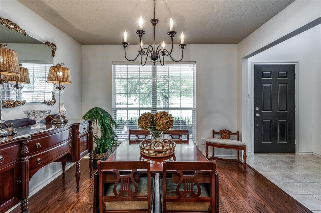 8606 Scooner Street Rowlett, TX 75089 - Photo 5 of 30 a view of a dining room with furniture window and wooden floor