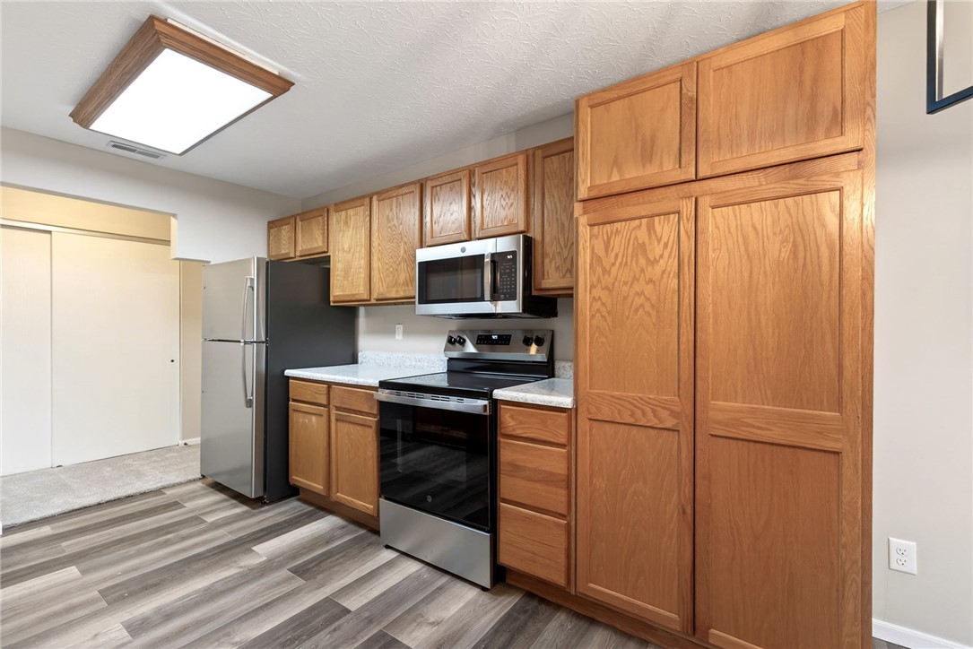 3151 Roesch Boulevard, Unit 6 Fairfield, OH 45014 - Photo 9 of 29 This thoughtfully designed kitchen boasts efficient appliances and ample storage, providing both functionality and style.