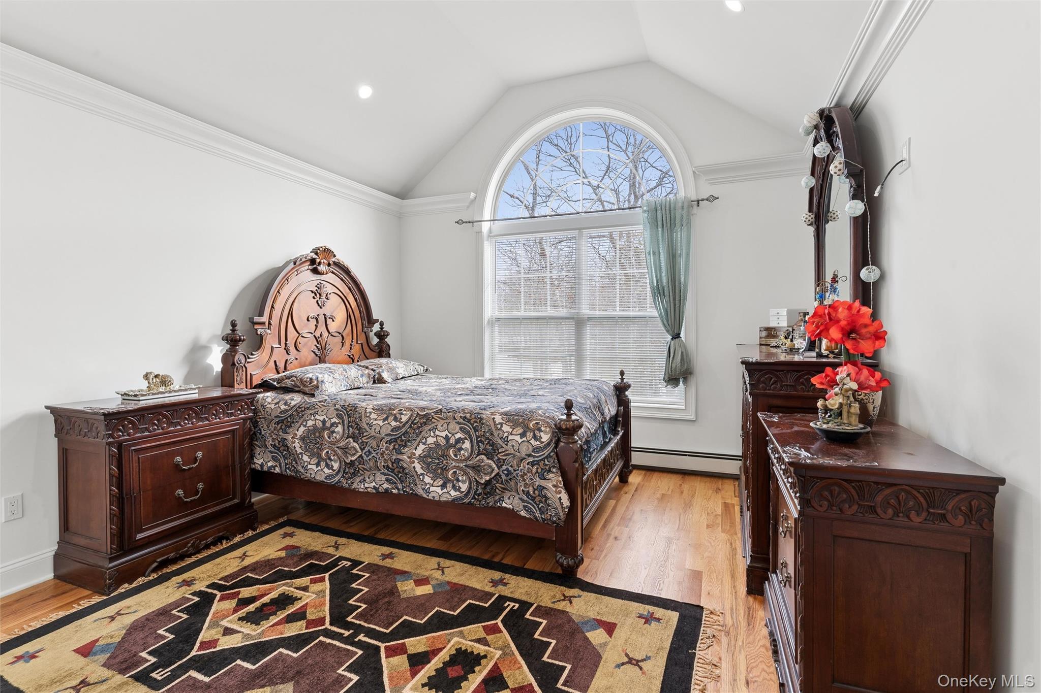 16 Gateway Court Hampton Bays, NY 11946 - Photo 16 of 30 a bed room with a bed and a baby crib
