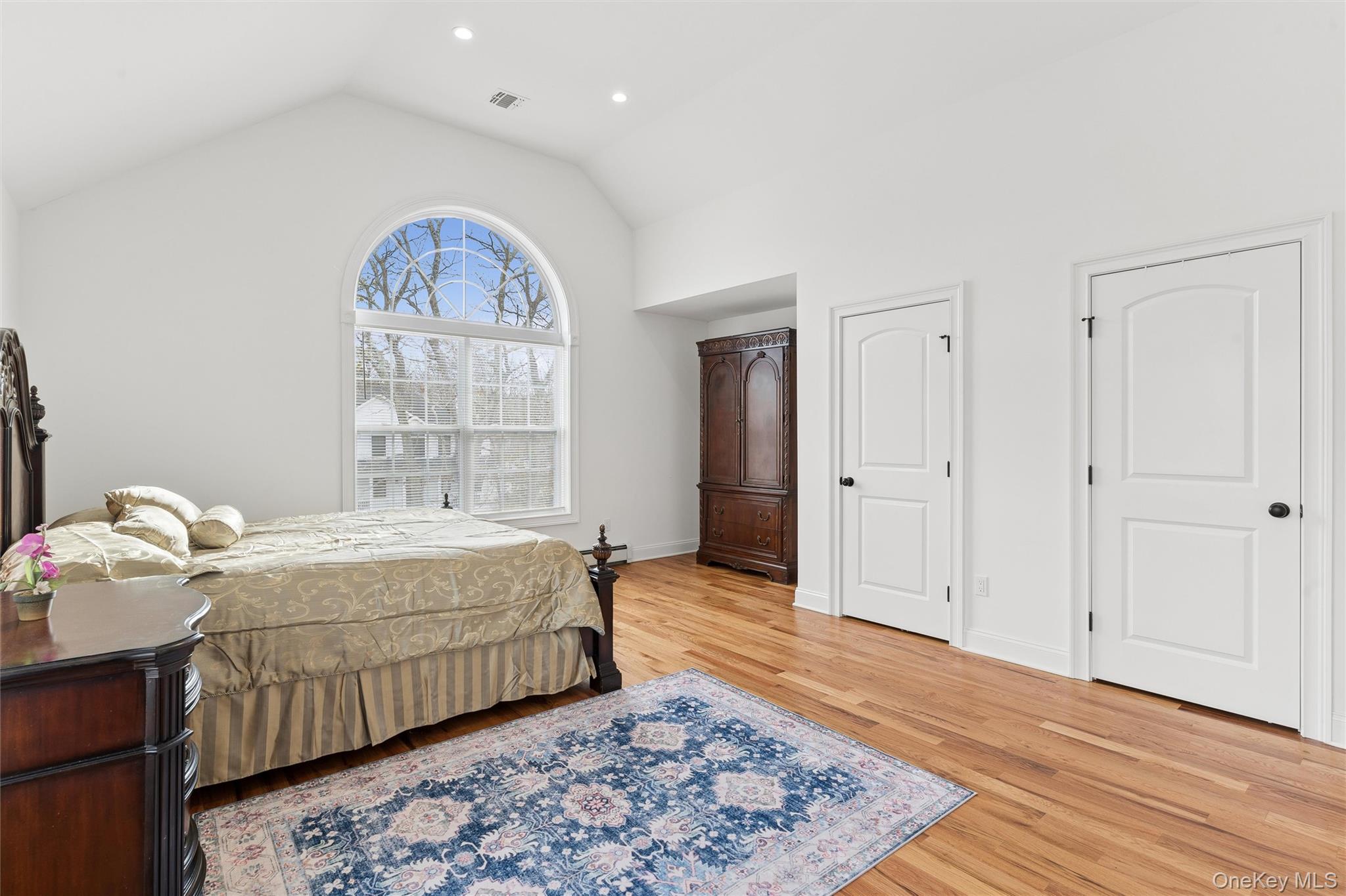 16 Gateway Court Hampton Bays, NY 11946 - Photo 18 of 30 a bedroom with a bed and a window