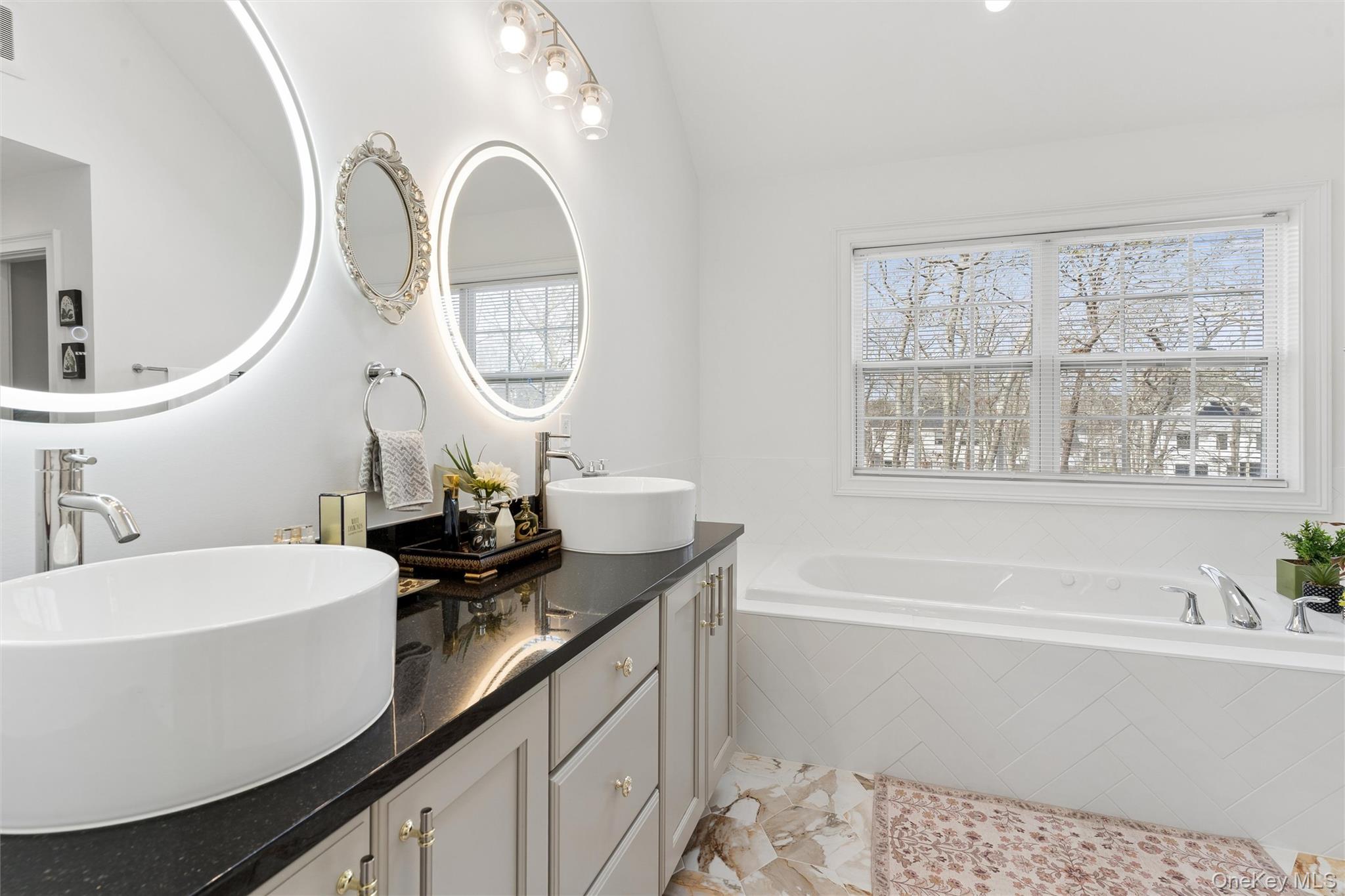 16 Gateway Court Hampton Bays, NY 11946 - Photo 22 of 30 a bathroom with a sink and a mirror