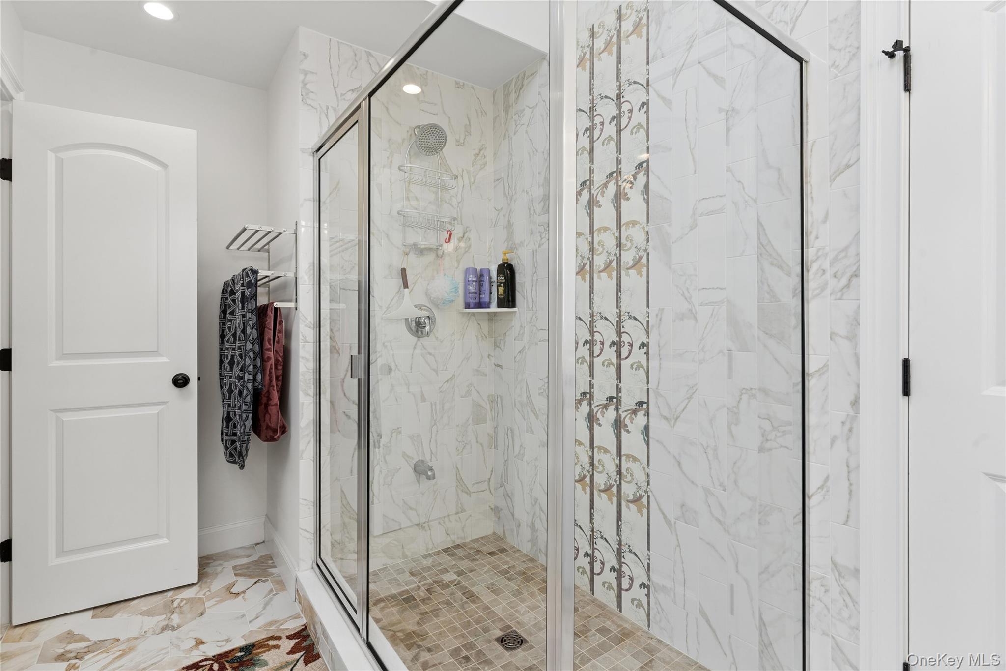 16 Gateway Court Hampton Bays, NY 11946 - Photo 23 of 30 a bathroom with a shower and a sink